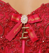 Lace-up corset ball gown w/ flowing layered skit & personalized letter brooch